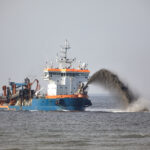 boat-dredging-Making-New-Land