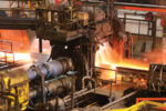 Ameridrives-Hot-steel-being-rolled-to-shape-in-mill-in-steel-manufacturing-plant