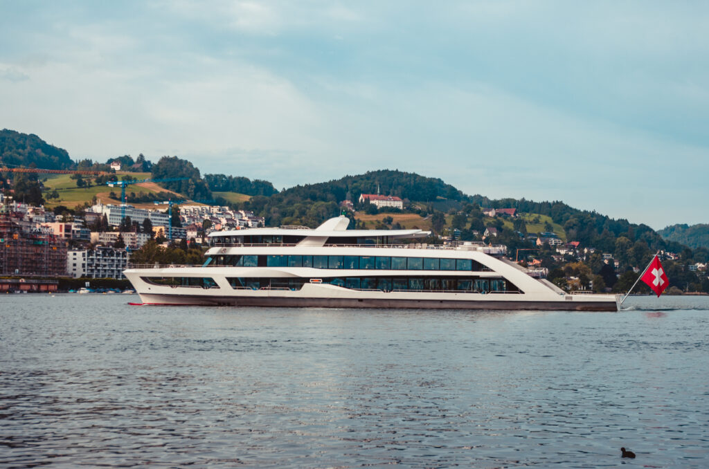 Cruise ship on lake Lucerne docking close to harbour overcast day 2019